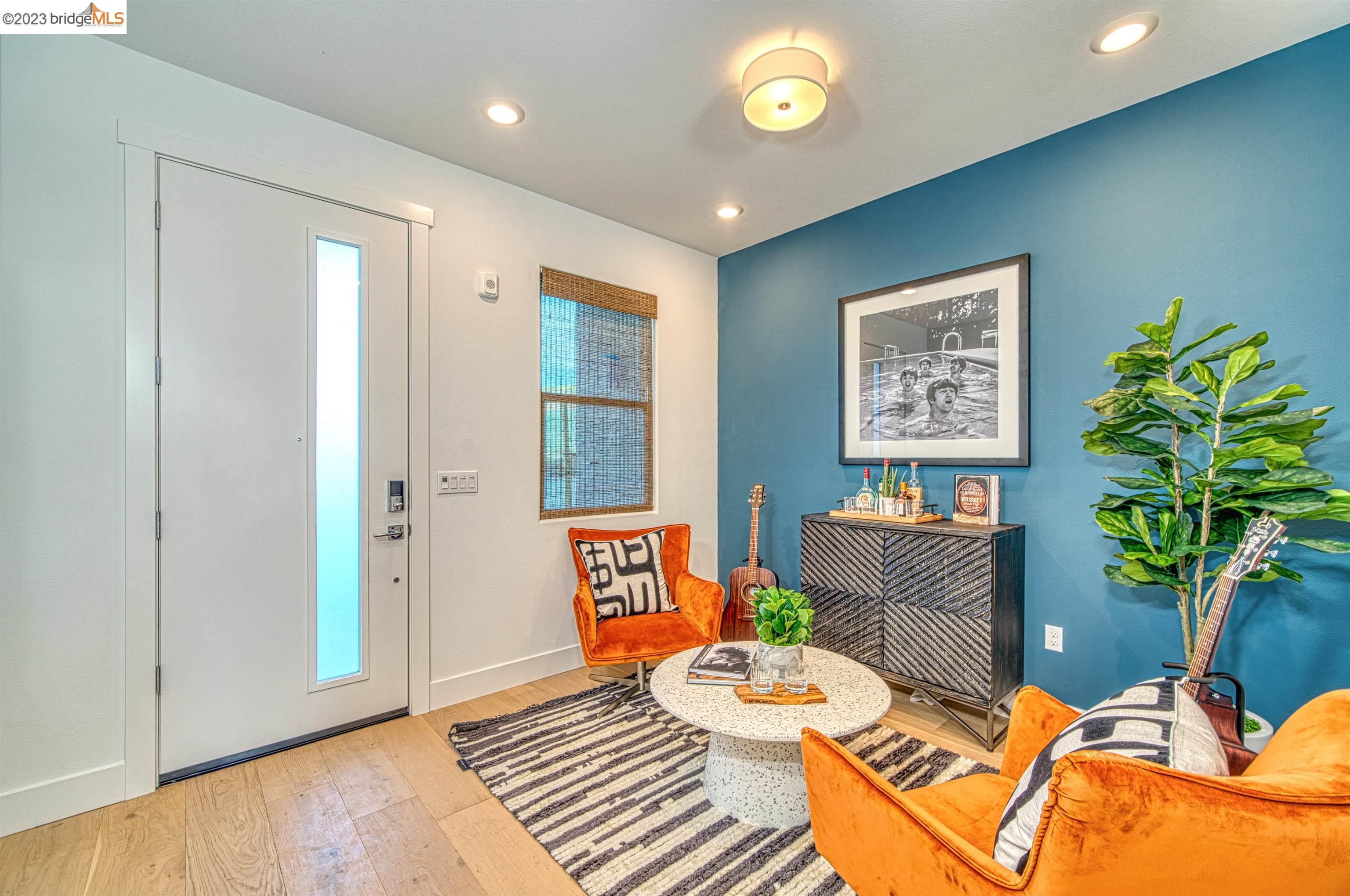 a living room with furniture and a potted plant