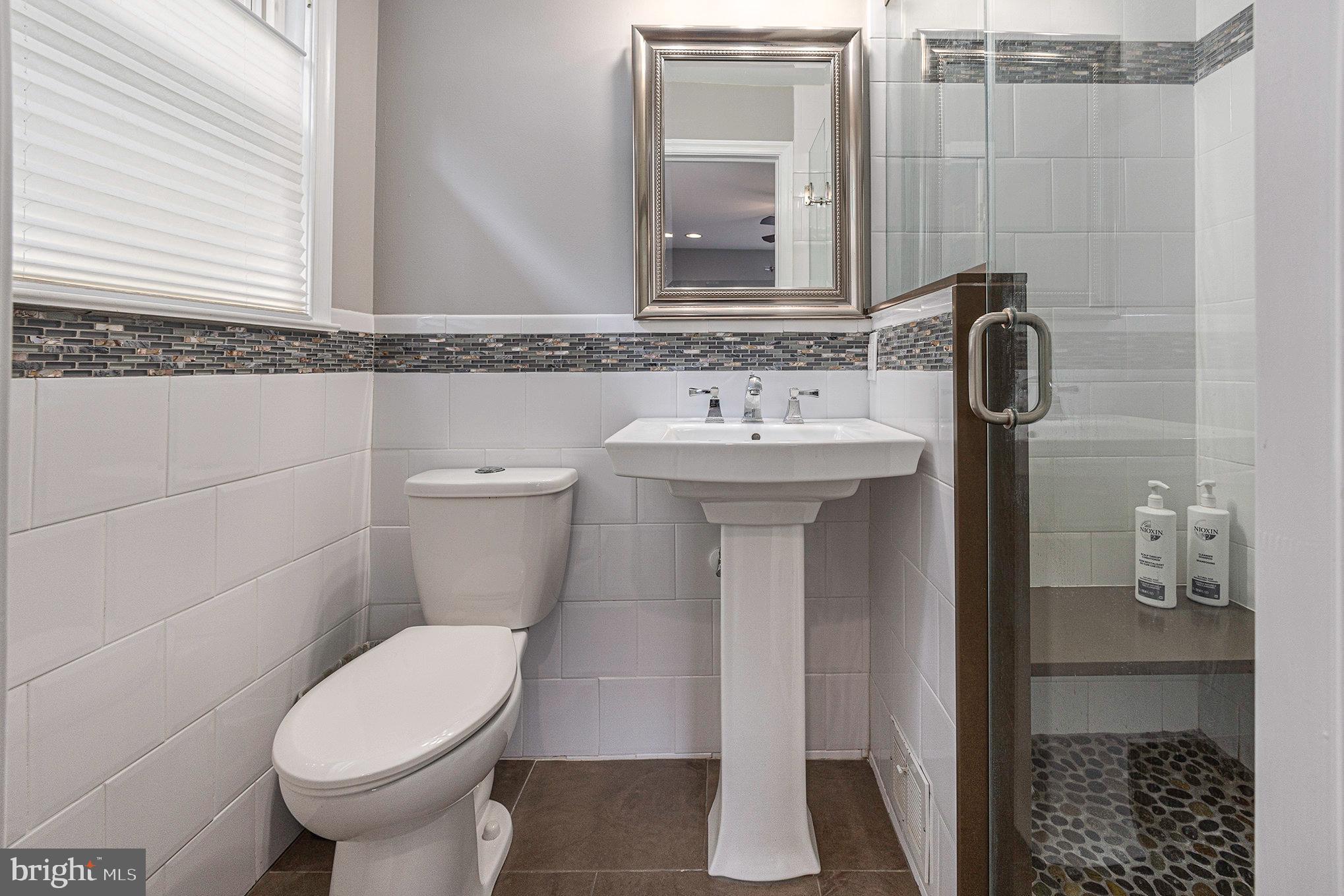 556 Forest Road Wayne, PA 19087 - Photo 18 of 35 a bathroom with a sink and a toilet
