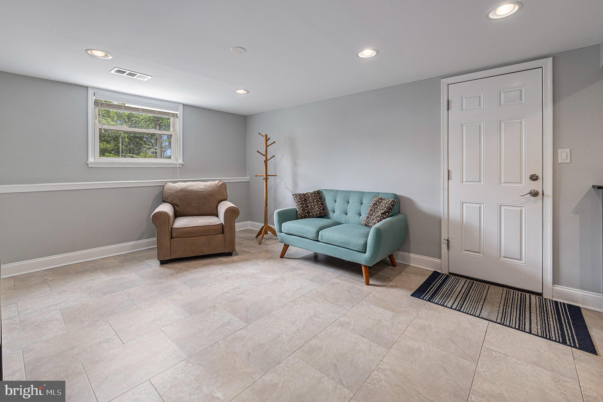 556 Forest Road Wayne, PA 19087 - Photo 22 of 35 a living room with furniture and a window