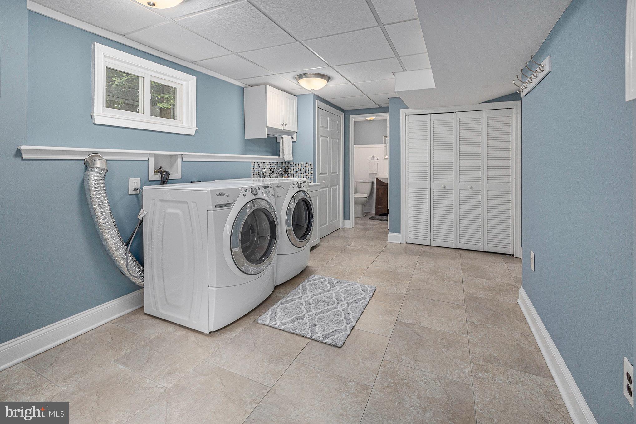 556 Forest Road Wayne, PA 19087 - Photo 24 of 35 a utility room with dryer and washer