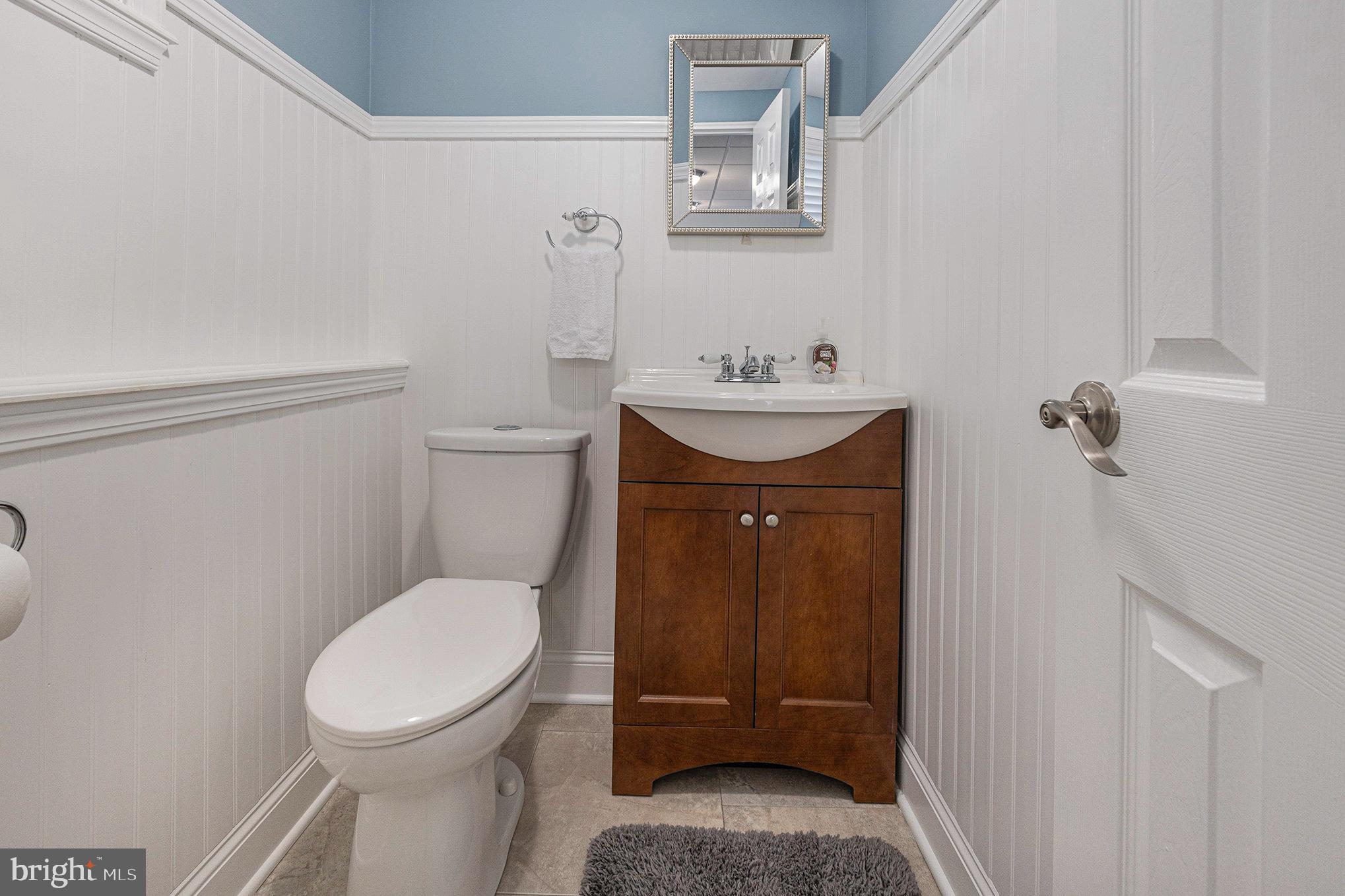 556 Forest Road Wayne, PA 19087 - Photo 26 of 35 a bathroom with a toilet sink and mirror