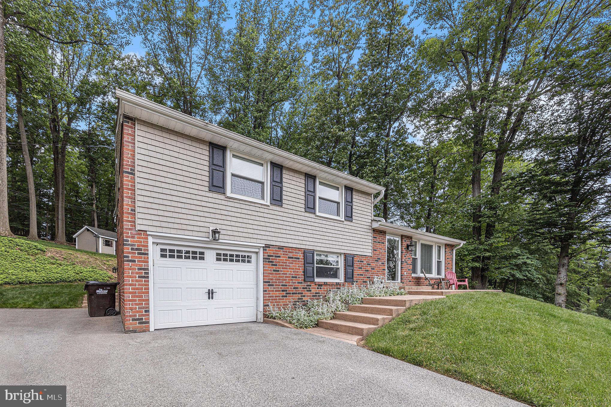 556 Forest Road Wayne, PA 19087 - Photo 3 of 35 a view of a house with a yard