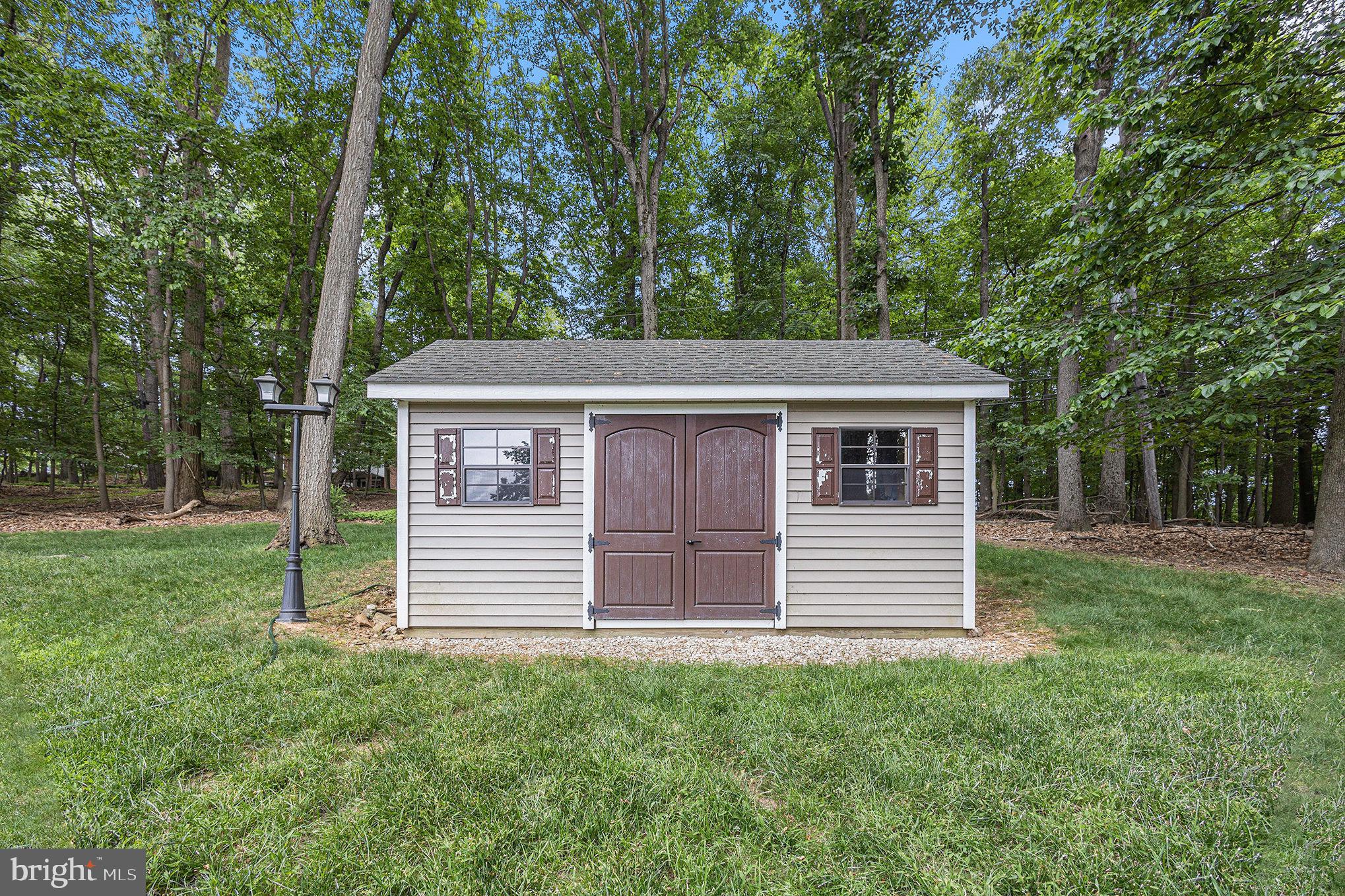 556 Forest Road Wayne, PA 19087 - Photo 31 of 35 front view of a house with a yard