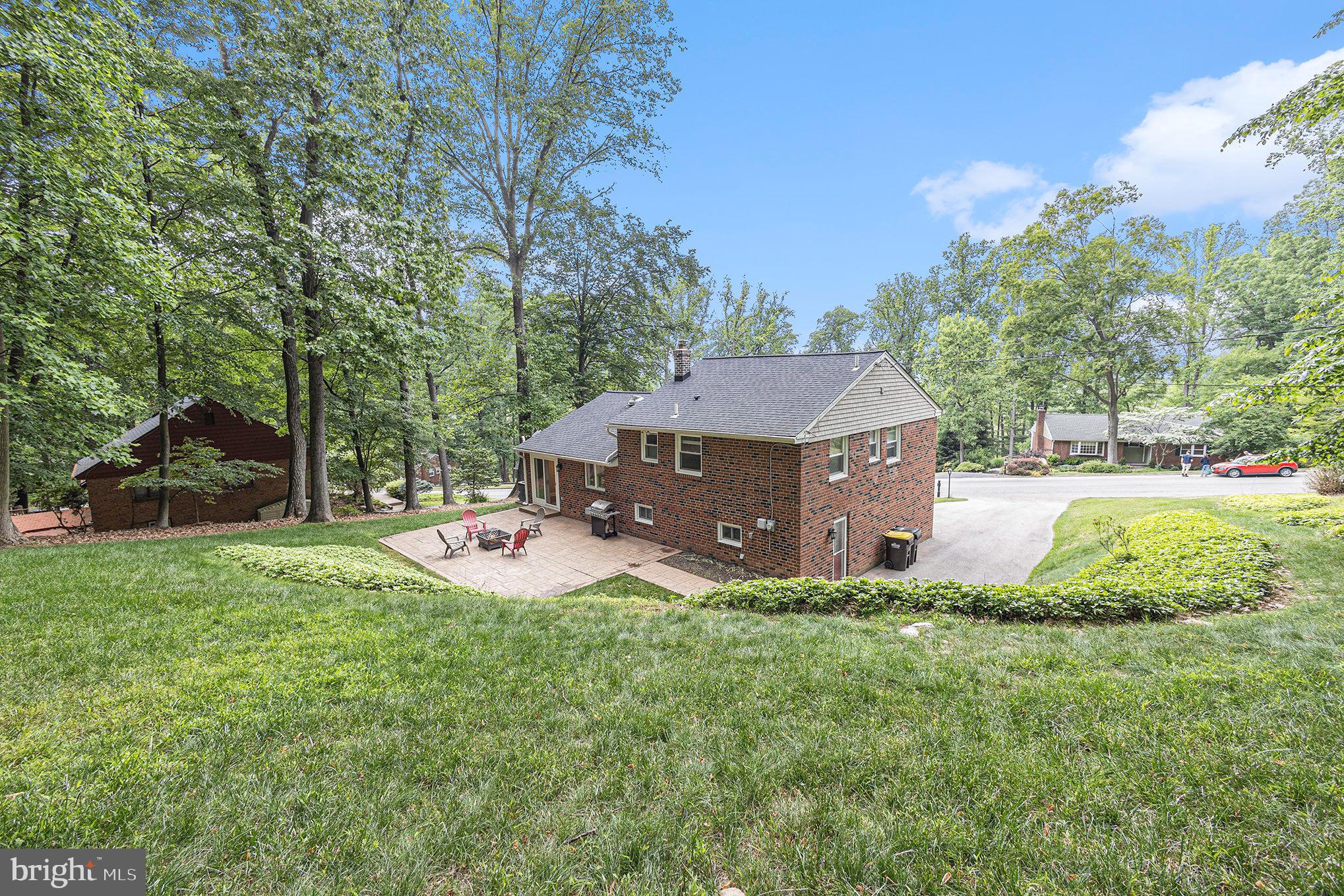 556 Forest Road Wayne, PA 19087 - Photo 34 of 35 a aerial view of a house with backyard and a garden