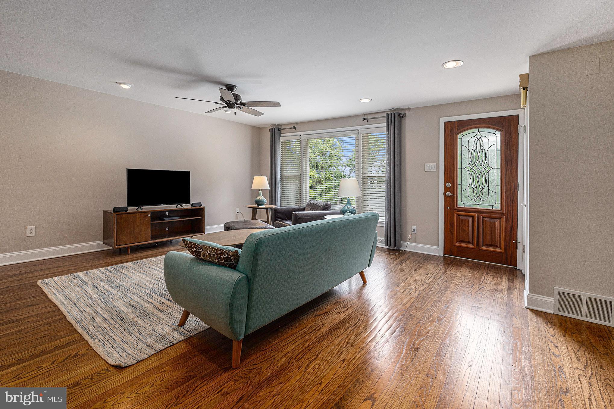 556 Forest Road Wayne, PA 19087 - Photo 5 of 35 a living room with furniture and a flat screen tv