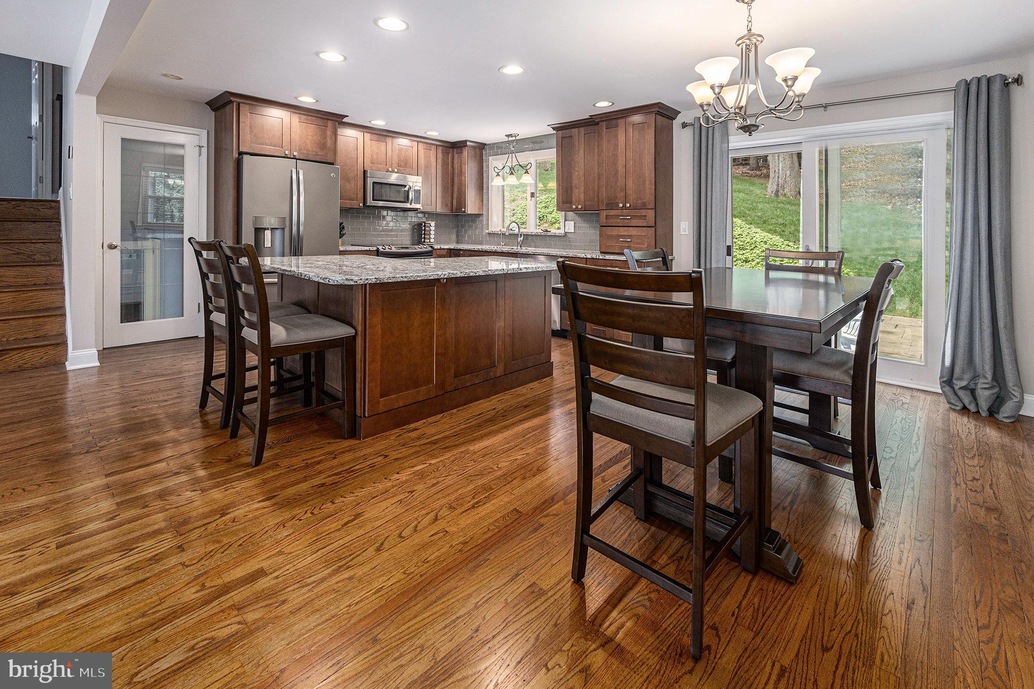 556 Forest Road Wayne, PA 19087 - Photo 7 of 35 a view of a dining room with furniture window and wooden floor