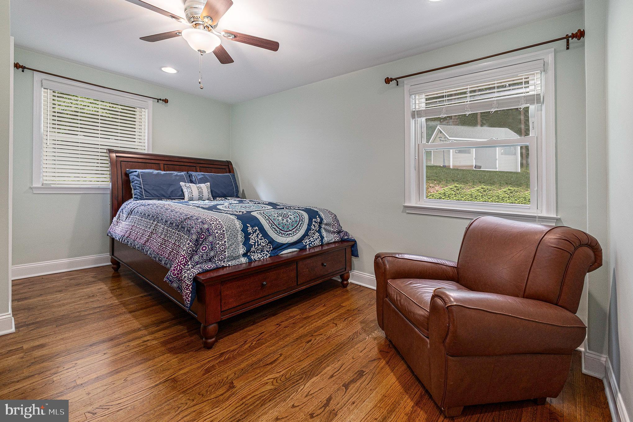 556 Forest Road Wayne, PA 19087 - Photo 10 of 35 a bedroom with a bed couch and window