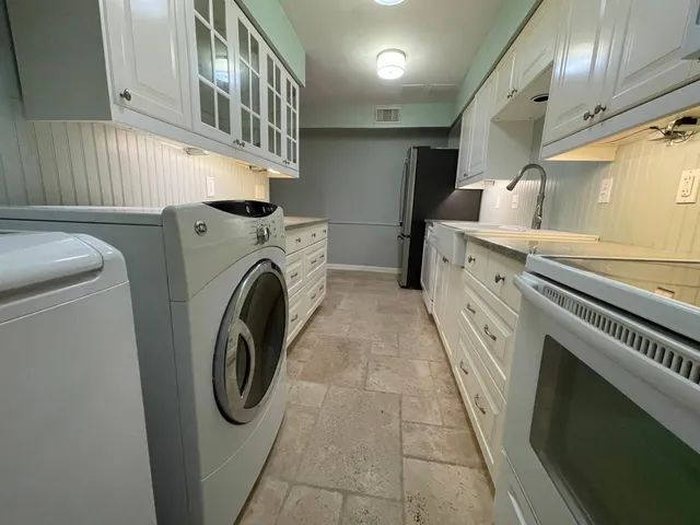 a utility room with dryer and washer