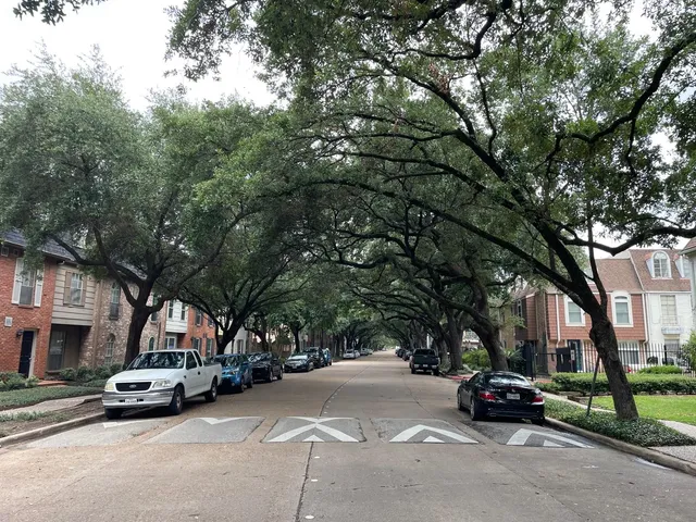 a view of street with parked cars