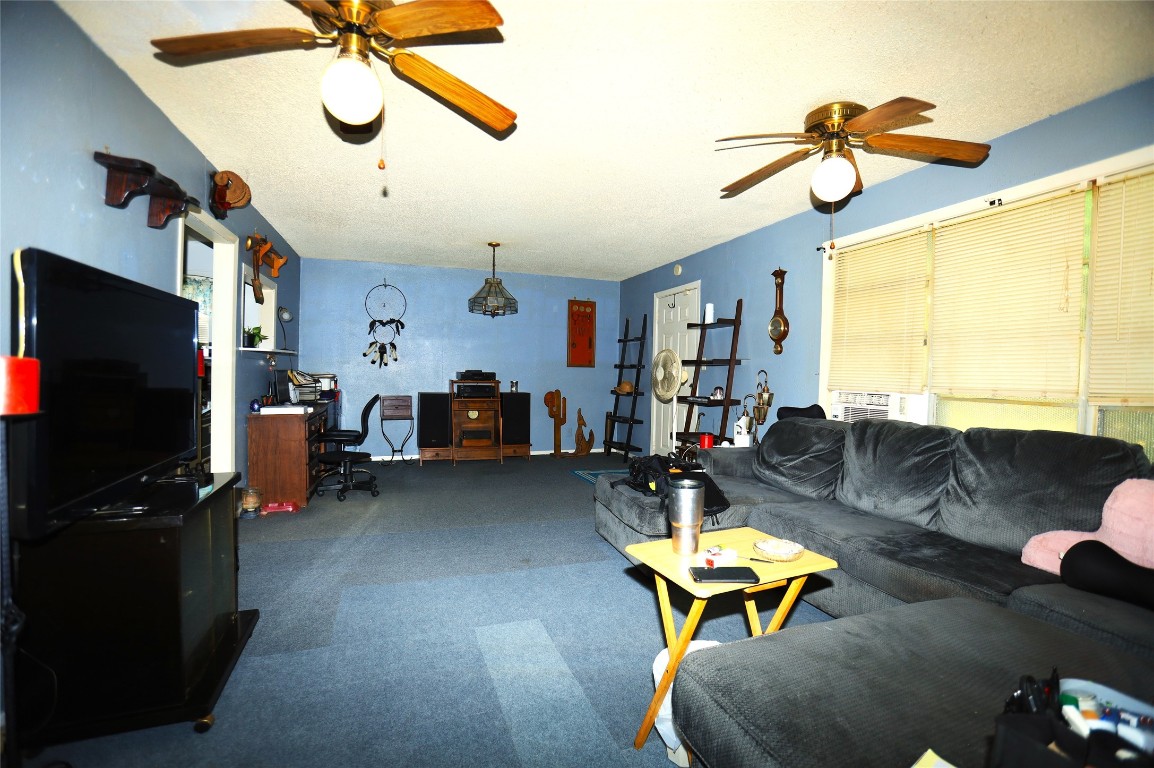 405 Center Way Lake Jackson, TX 77566 - Photo 11 of 21 a living room with furniture and a flat screen tv