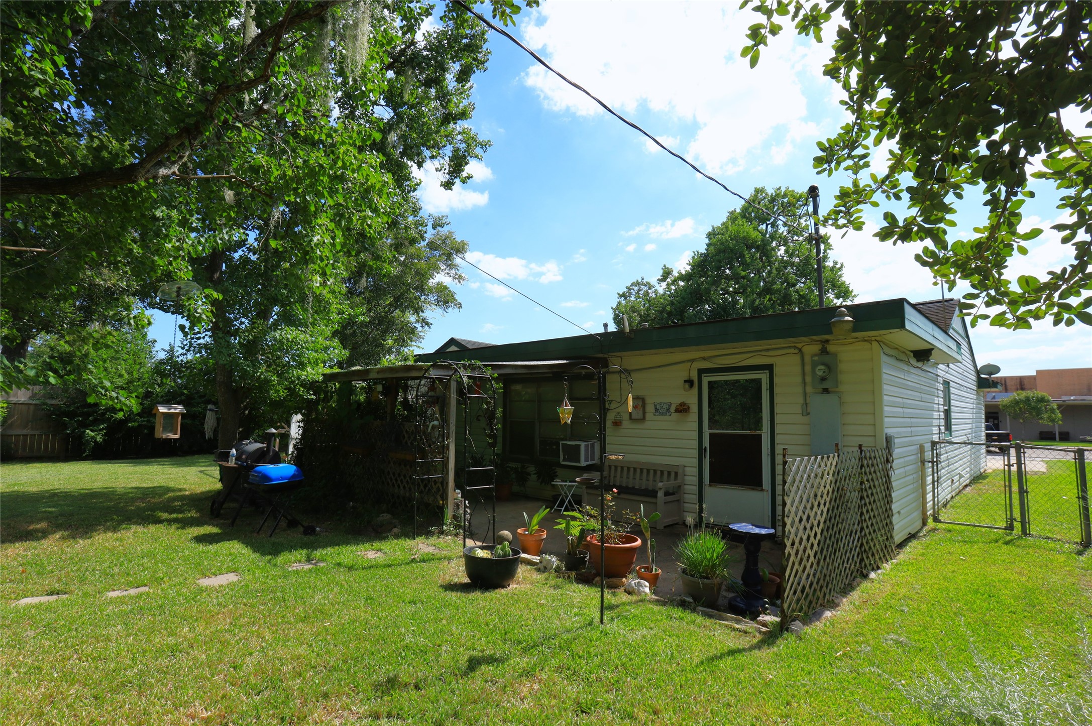 405 Center Way Lake Jackson, TX 77566 - Photo 21 of 21 a view of a chair and table in backyard of the house