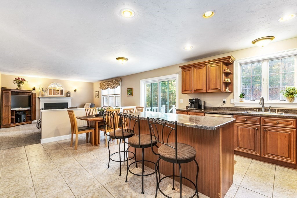47 Mayflower Lane Rochester, MA 02770 - Photo 14 of 40 a large kitchen with a table and chairs in it