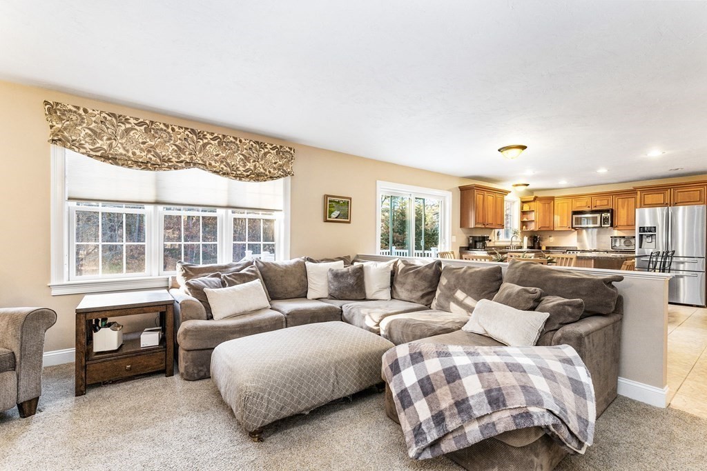 47 Mayflower Lane Rochester, MA 02770 - Photo 16 of 40 a living room with furniture and a large window