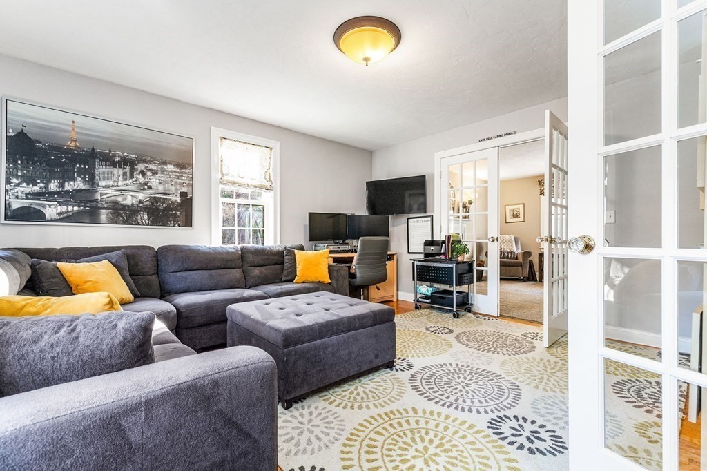 47 Mayflower Lane Rochester, MA 02770 - Photo 18 of 40 a living room with furniture and a flat screen tv