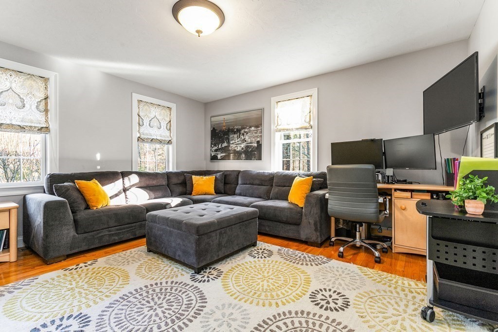47 Mayflower Lane Rochester, MA 02770 - Photo 19 of 40 a living room with furniture fireplace and a window