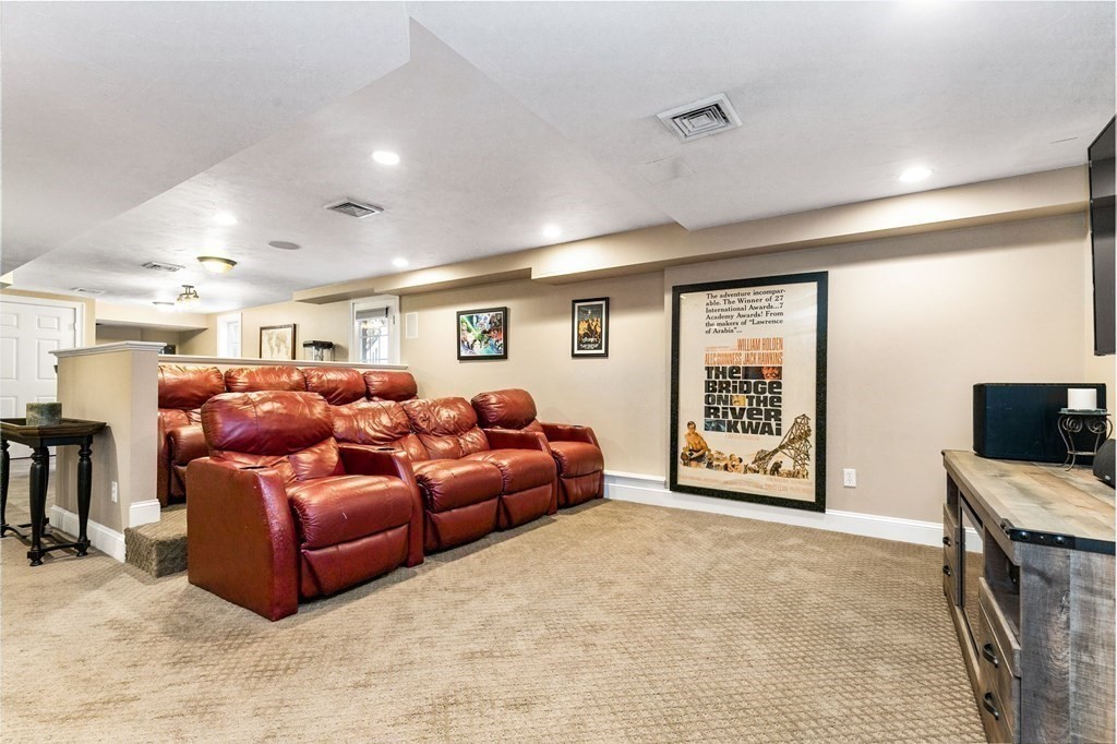 47 Mayflower Lane Rochester, MA 02770 - Photo 22 of 40 a living room with furniture and a flat screen tv