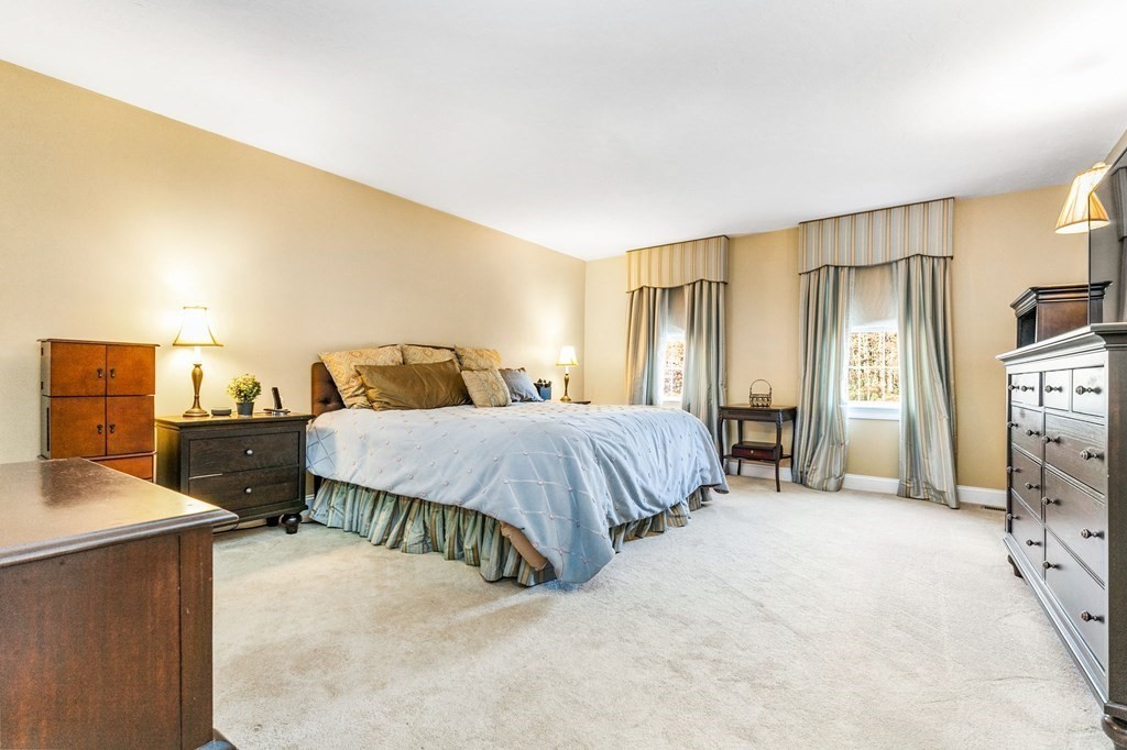 47 Mayflower Lane Rochester, MA 02770 - Photo 24 of 40 a bedroom with a bed and a flat screen tv