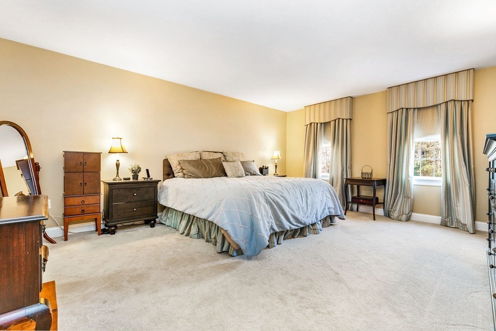 47 Mayflower Lane Rochester, MA 02770 - Photo 25 of 40 a spacious bedroom with a bed and a couch