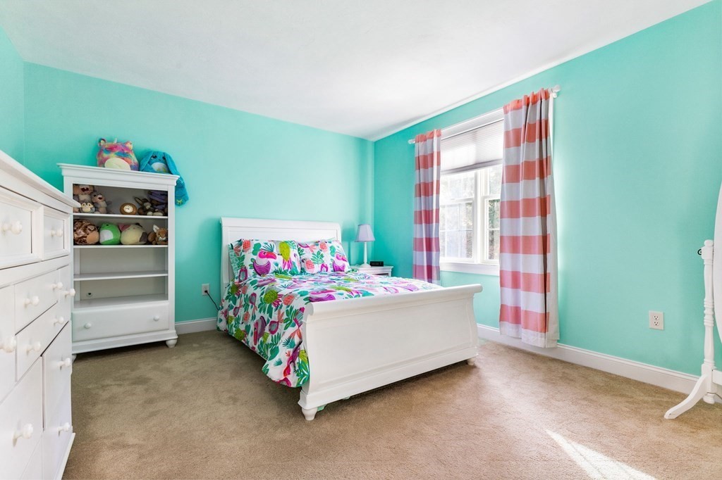 47 Mayflower Lane Rochester, MA 02770 - Photo 26 of 40 a bedroom with a bed and a window