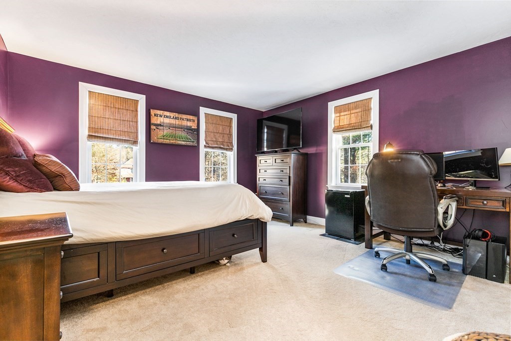 47 Mayflower Lane Rochester, MA 02770 - Photo 27 of 40 a bedroom with a bed and wooden floor