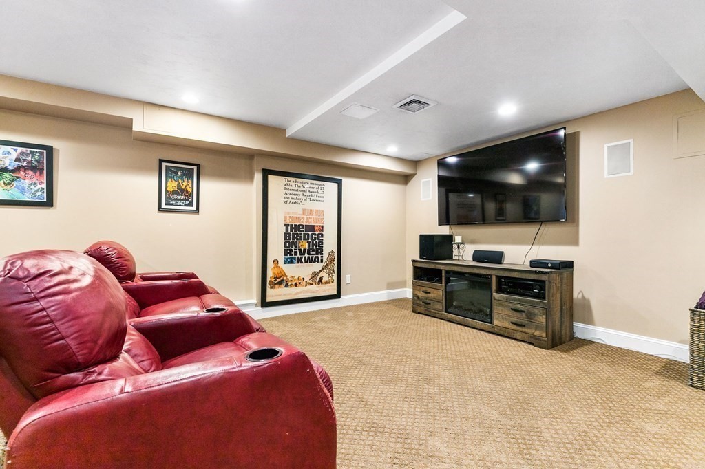47 Mayflower Lane Rochester, MA 02770 - Photo 30 of 40 a living room with furniture and a flat screen tv