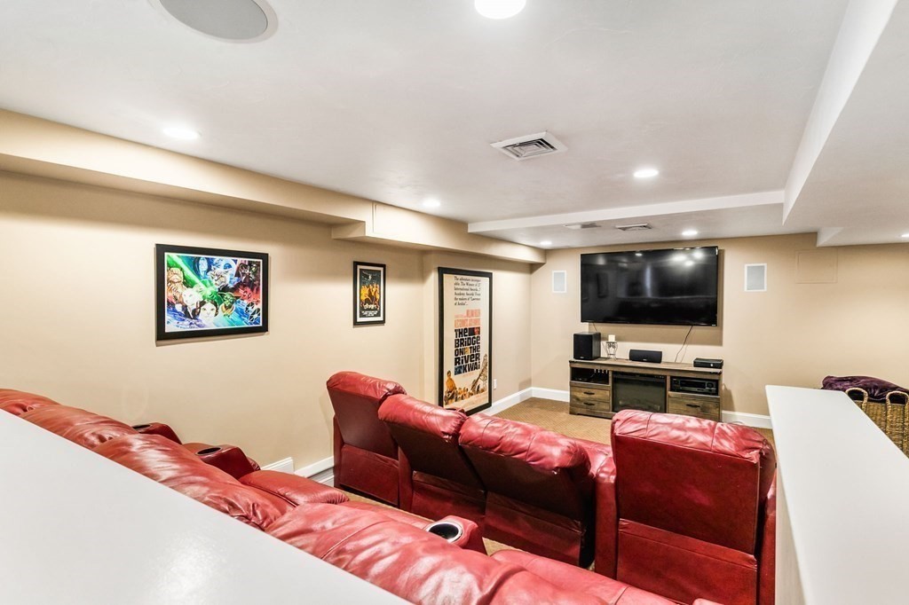 47 Mayflower Lane Rochester, MA 02770 - Photo 31 of 40 a living room with furniture and a flat screen tv