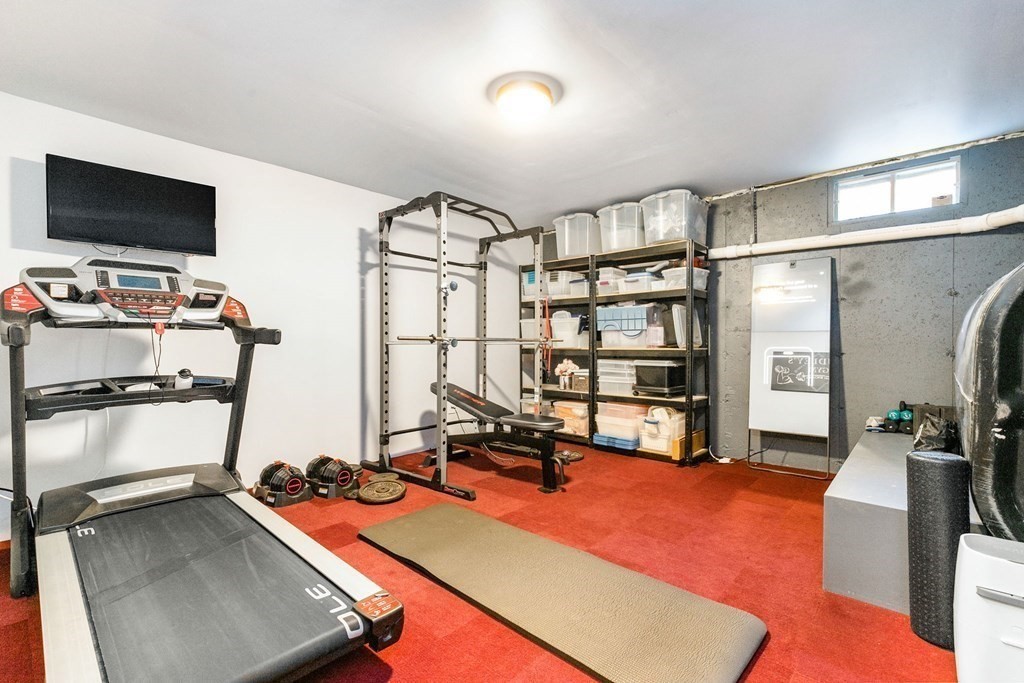 47 Mayflower Lane Rochester, MA 02770 - Photo 35 of 40 a room with gym equipment and a flat screen tv