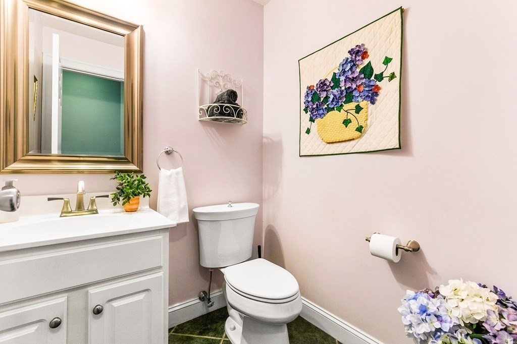 47 Mayflower Lane Rochester, MA 02770 - Photo 37 of 40 a bathroom with a toilet sink and mirror