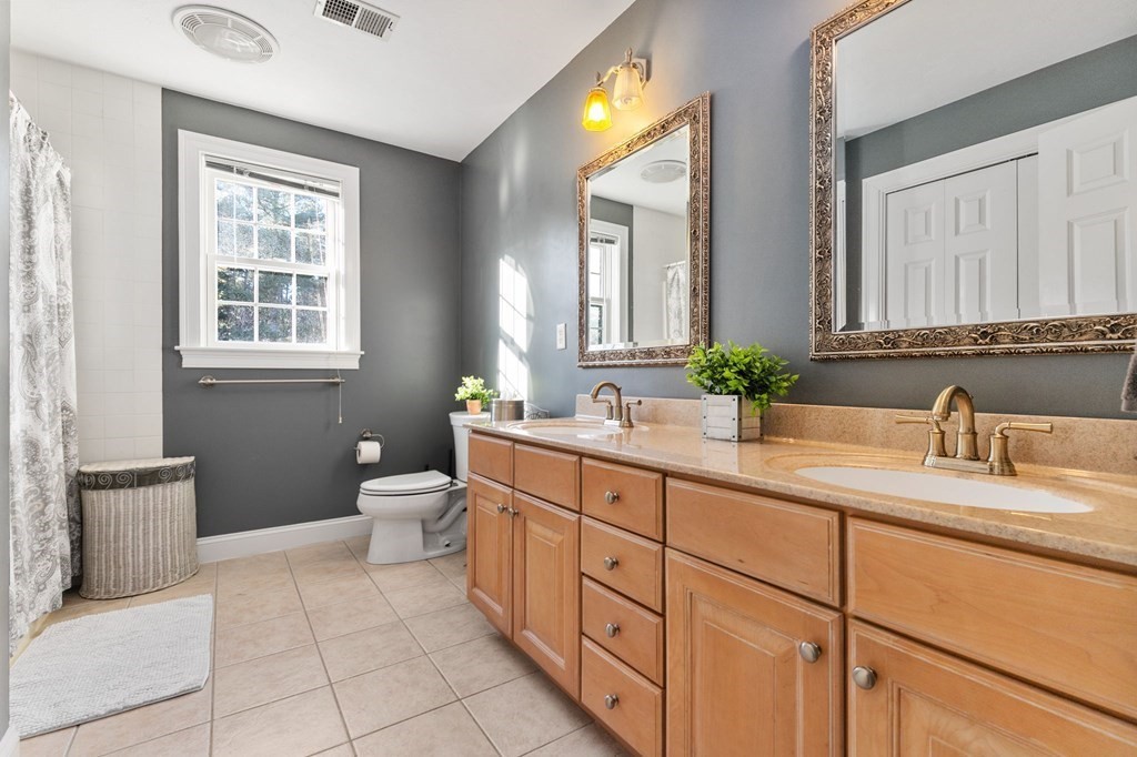 47 Mayflower Lane Rochester, MA 02770 - Photo 39 of 40 a bathroom with a granite countertop sink toilet and mirror