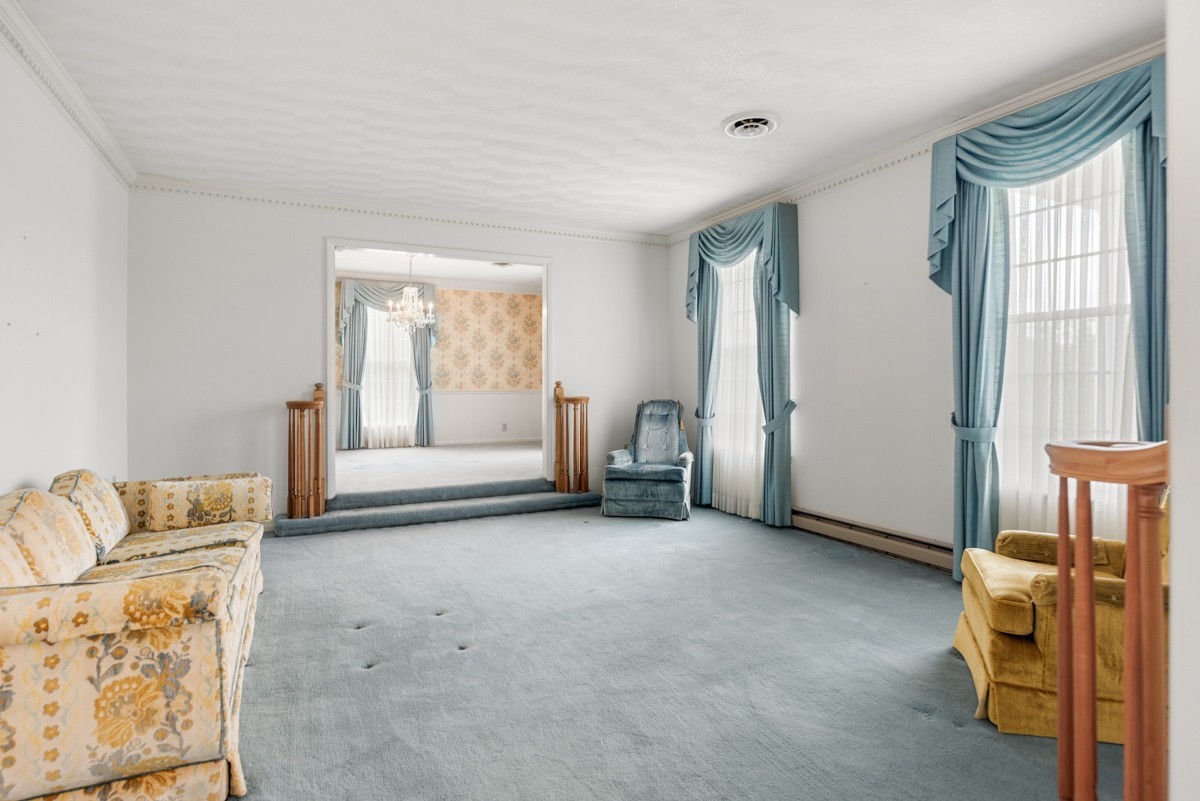 6908 River Rd Pike Nashville, TN 37209 - Photo 11 of 47 a living room with furniture and a window