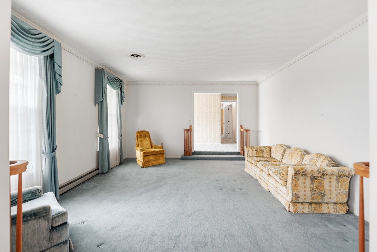 6908 River Rd Pike Nashville, TN 37209 - Photo 12 of 47 a view of an empty room with furniture and a window