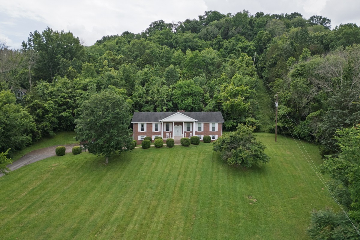 6908 River Rd Pike Nashville, TN 37209 - Photo 2 of 47 a view of a house with a big yard