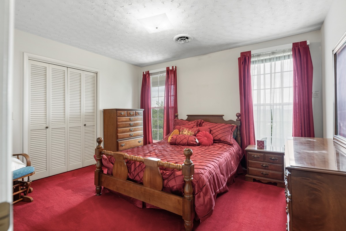 6908 River Rd Pike Nashville, TN 37209 - Photo 30 of 47 a bedroom with a bed and a window