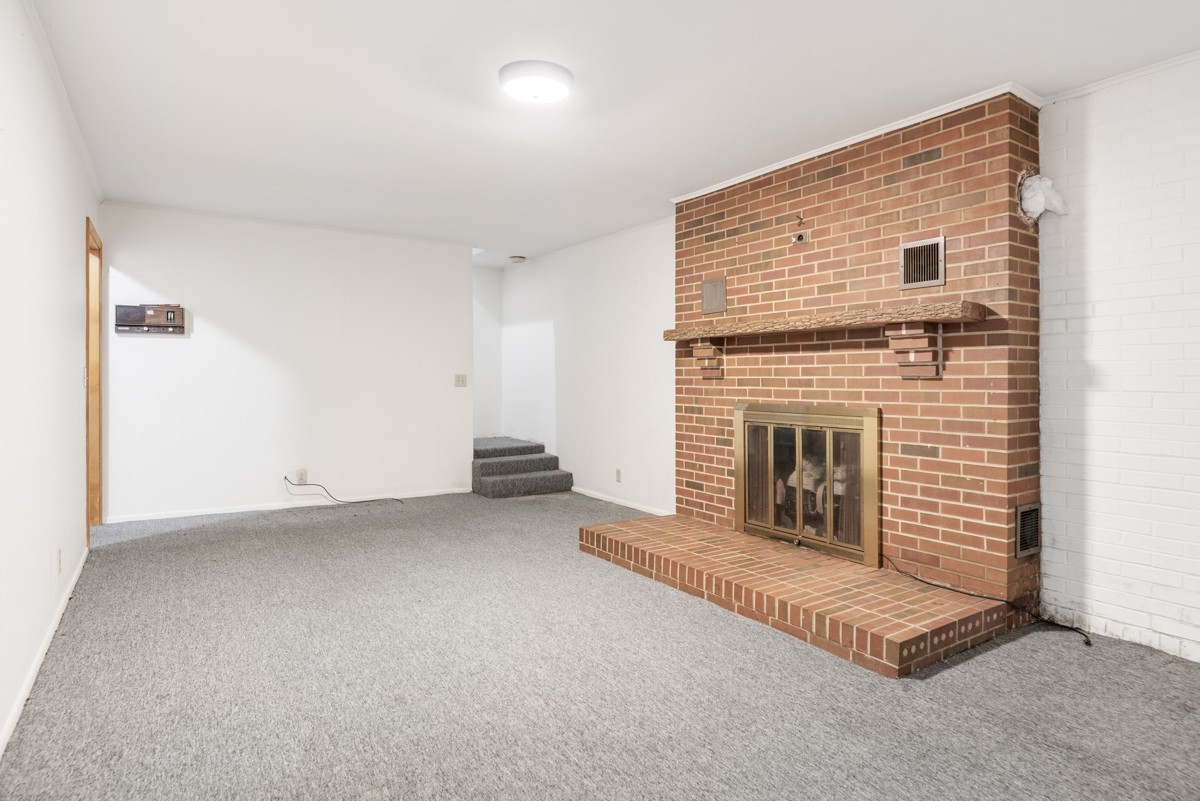 6908 River Rd Pike Nashville, TN 37209 - Photo 31 of 47 an empty room with a fireplace