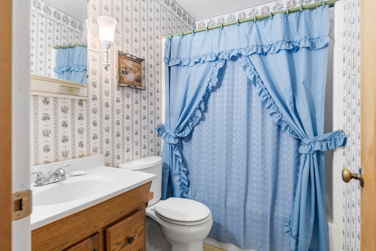 6908 River Rd Pike Nashville, TN 37209 - Photo 37 of 47 a bathroom with a sink toilet and shower
