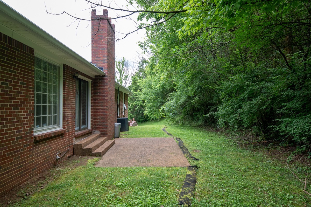 6908 River Rd Pike Nashville, TN 37209 - Photo 40 of 47 a view of a house with a backyard