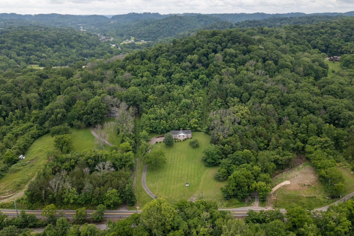 6908 River Rd Pike Nashville, TN 37209 - Photo 4 of 47 a view of a lake with a forest
