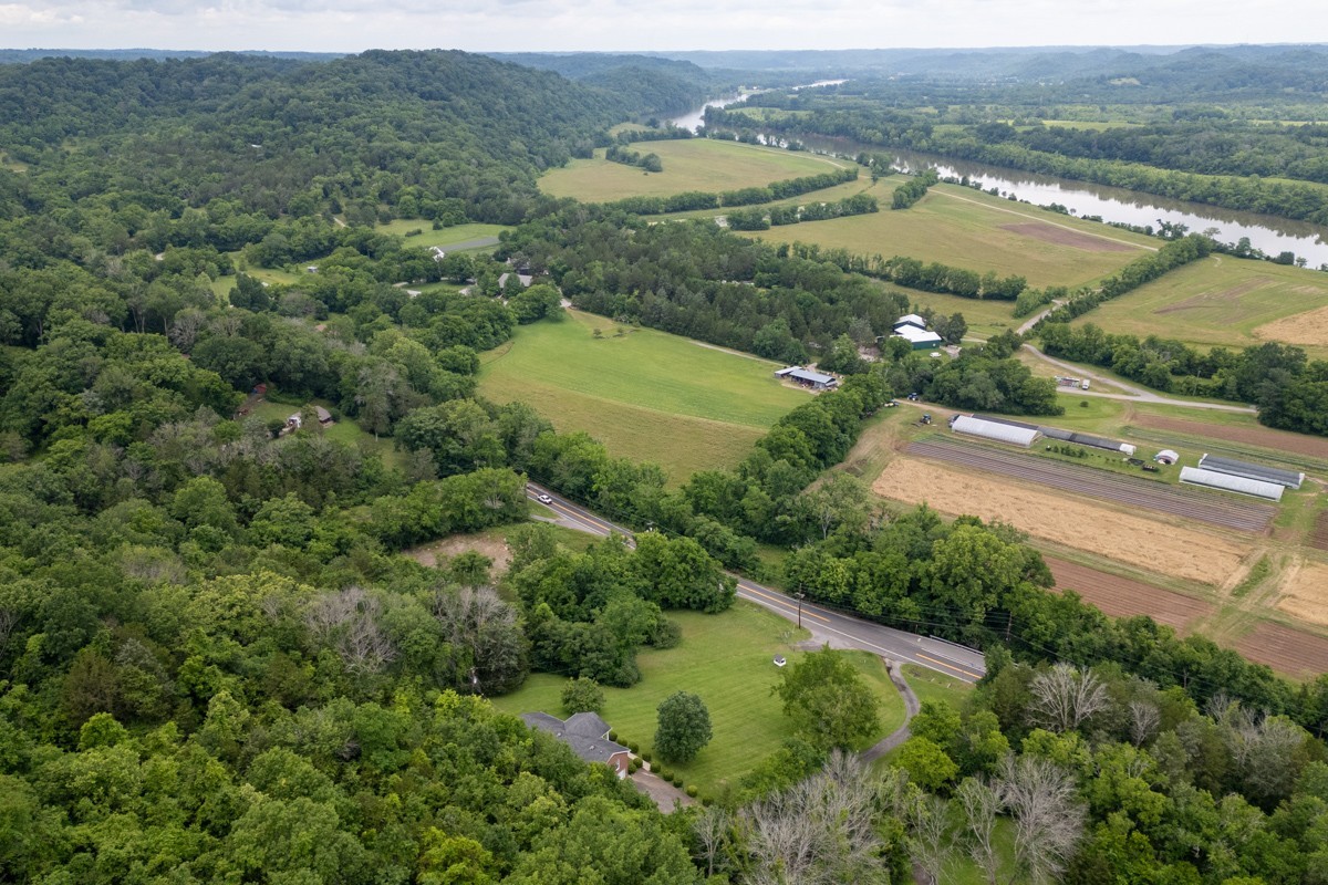 6908 River Rd Pike Nashville, TN 37209 - Photo 44 of 47 an aerial view of residential houses with outdoor space and trees