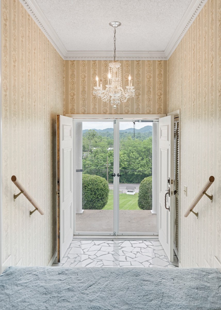 6908 River Rd Pike Nashville, TN 37209 - Photo 10 of 47 wooden floor in an empty room with a window