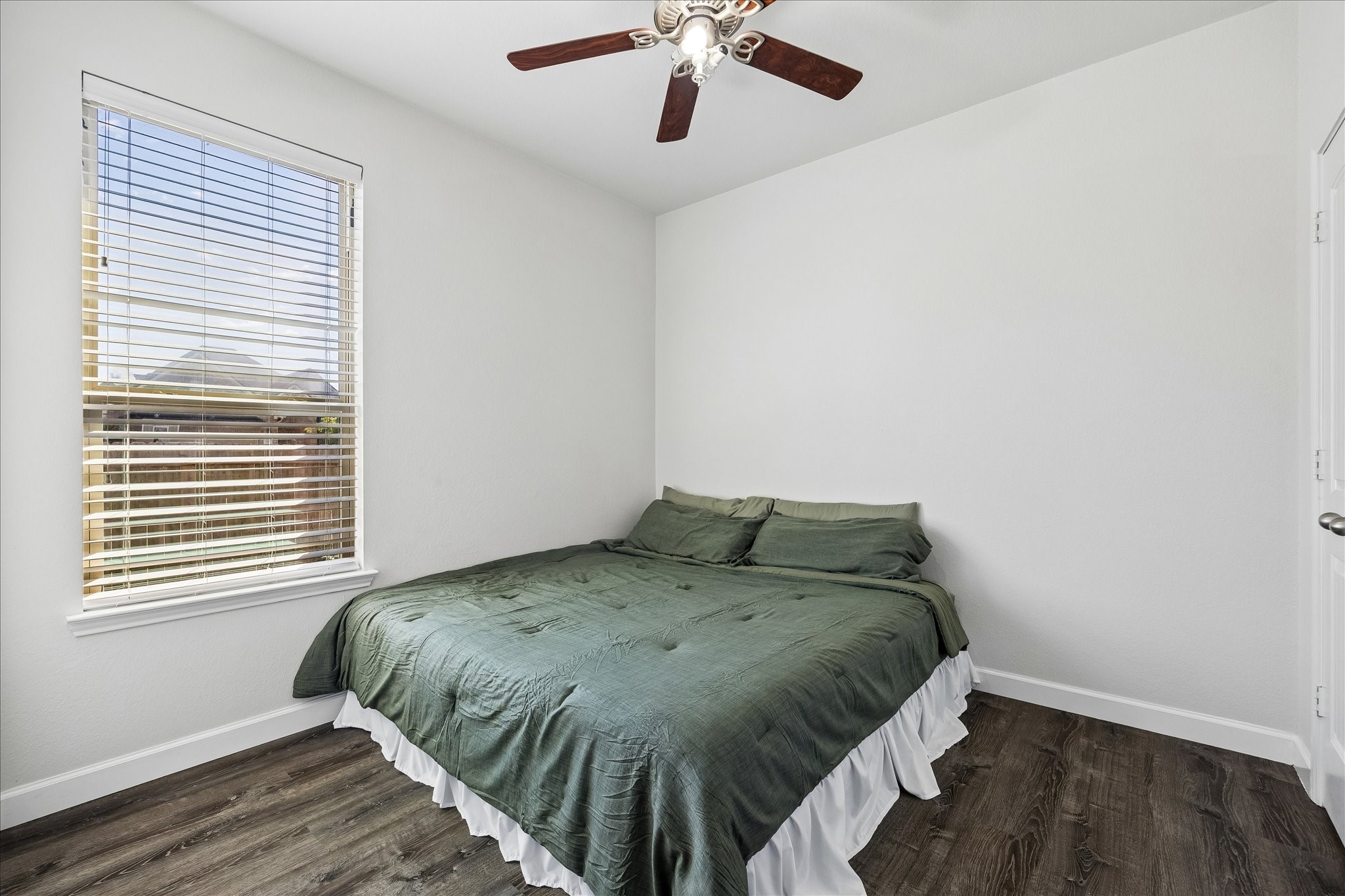 326 Ralston Ranch Court Richmond, TX 77469 - Photo 16 of 28 Well-sized secondary bedroom with large window, high ceiling, and a generous closet for added comfort.