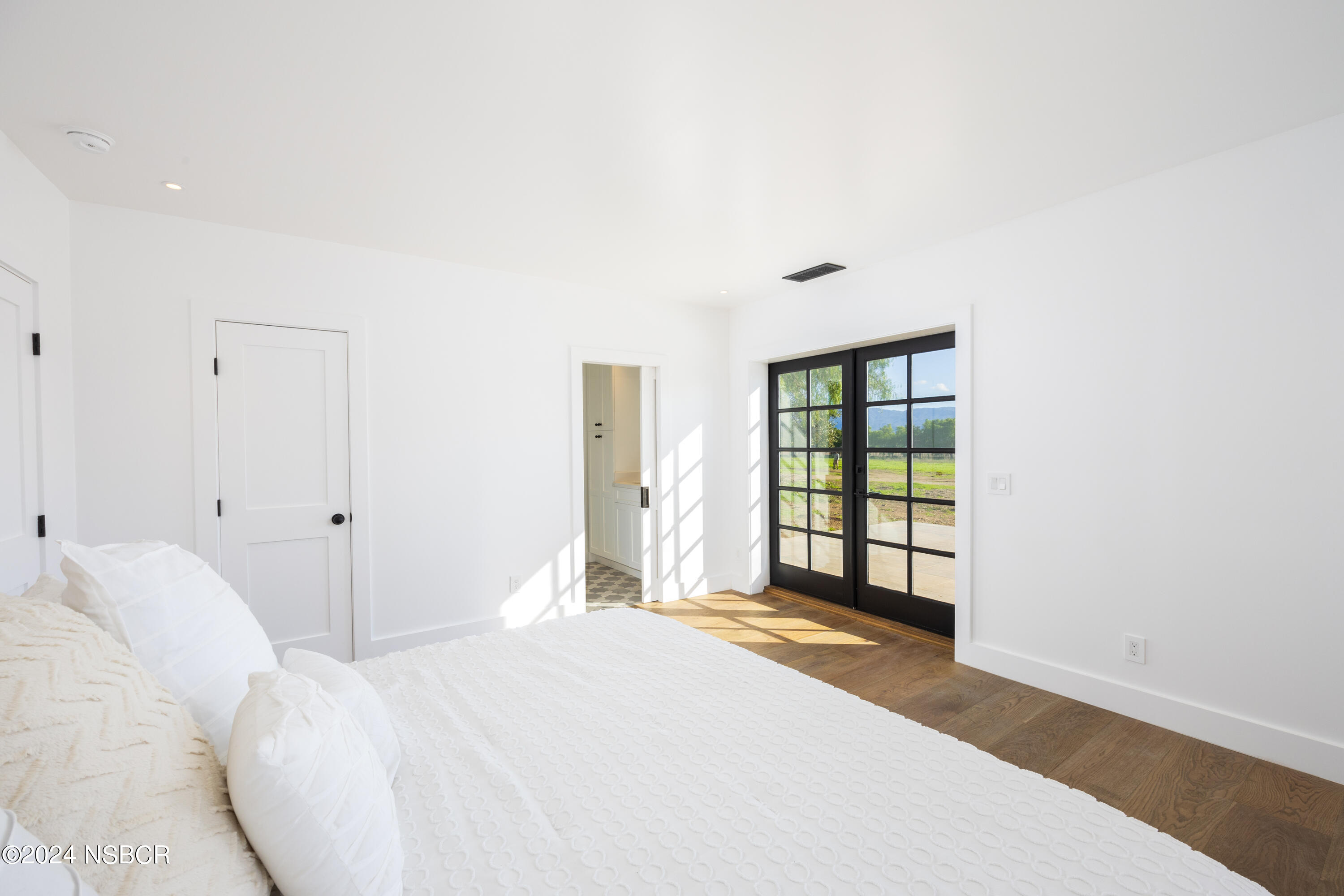 2380 North Refugio Road Santa Ynez, CA 93460 - Photo 15 of 38 a bedroom with a bed and a window
