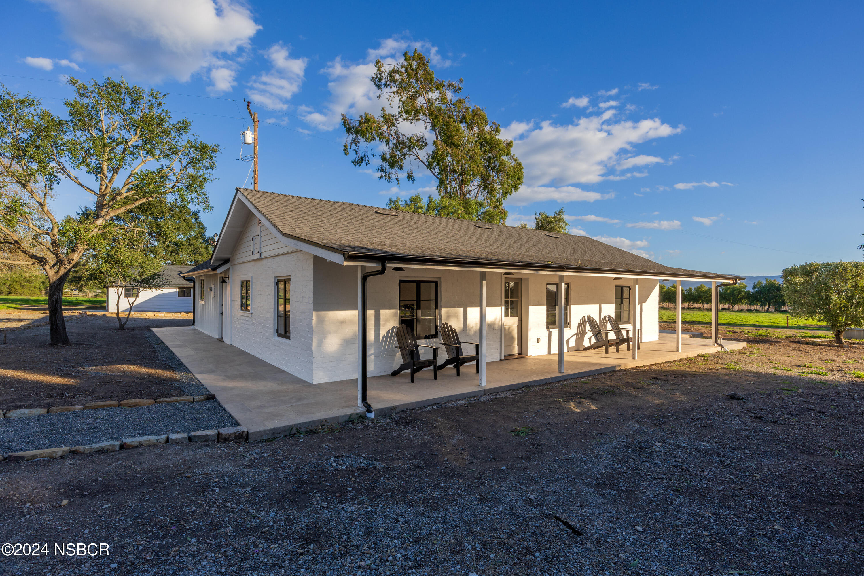 2380 North Refugio Road Santa Ynez, CA 93460 - Photo 2 of 38 a front view of a house with a yard