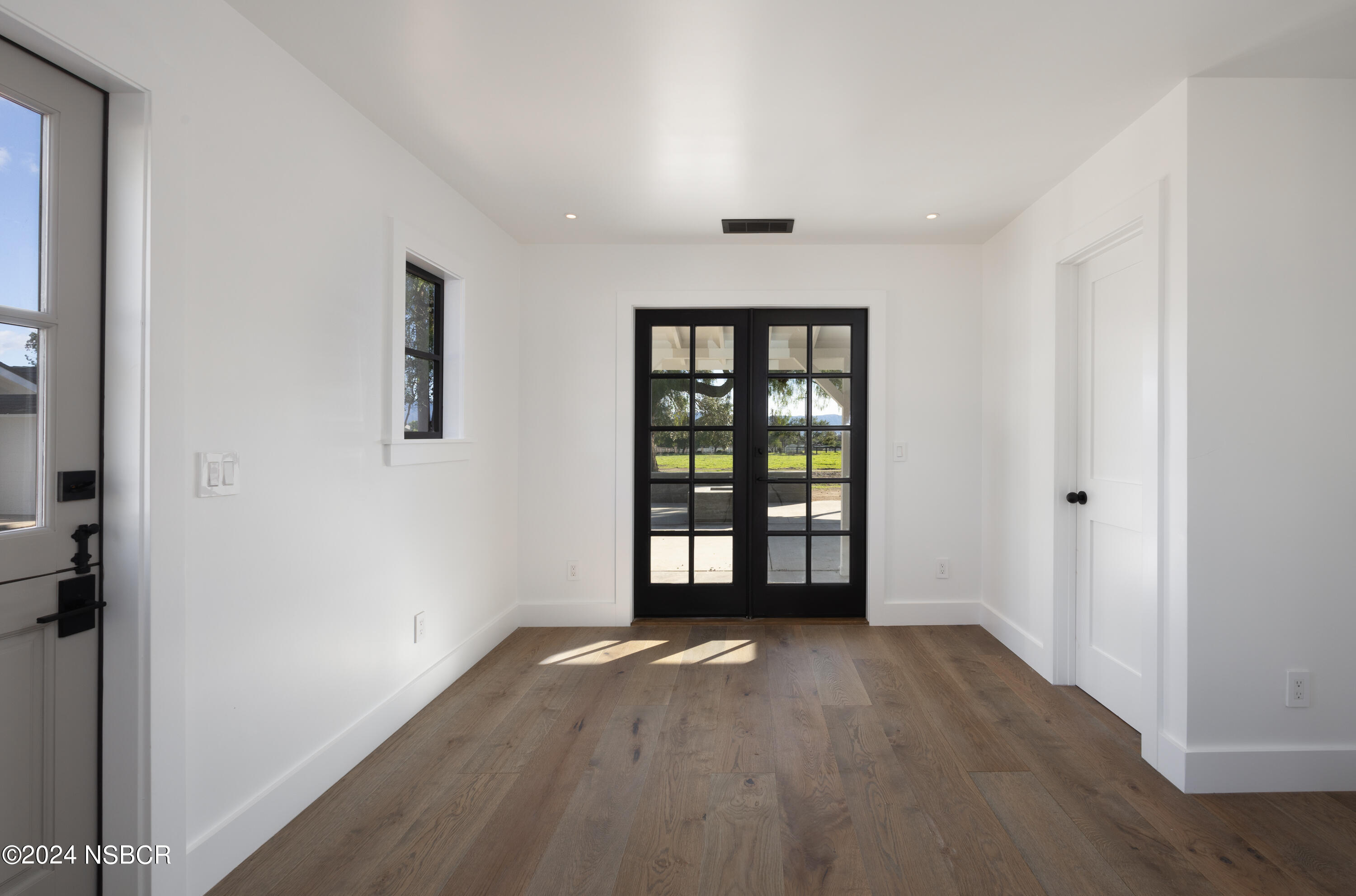 2380 North Refugio Road Santa Ynez, CA 93460 - Photo 22 of 38 an empty room with windows and closet