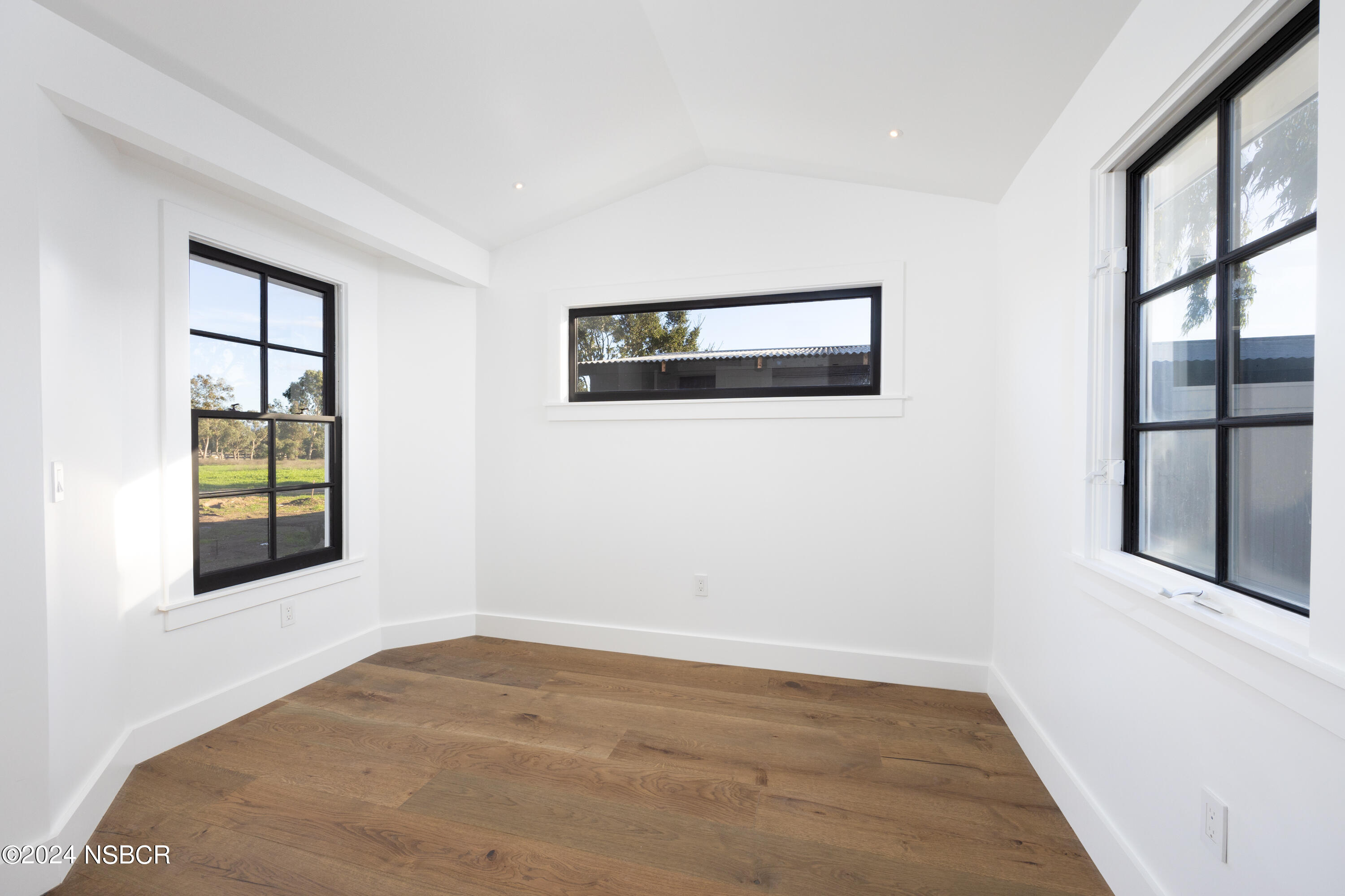 2380 North Refugio Road Santa Ynez, CA 93460 - Photo 28 of 38 a view of an empty room with a window and wooden floor