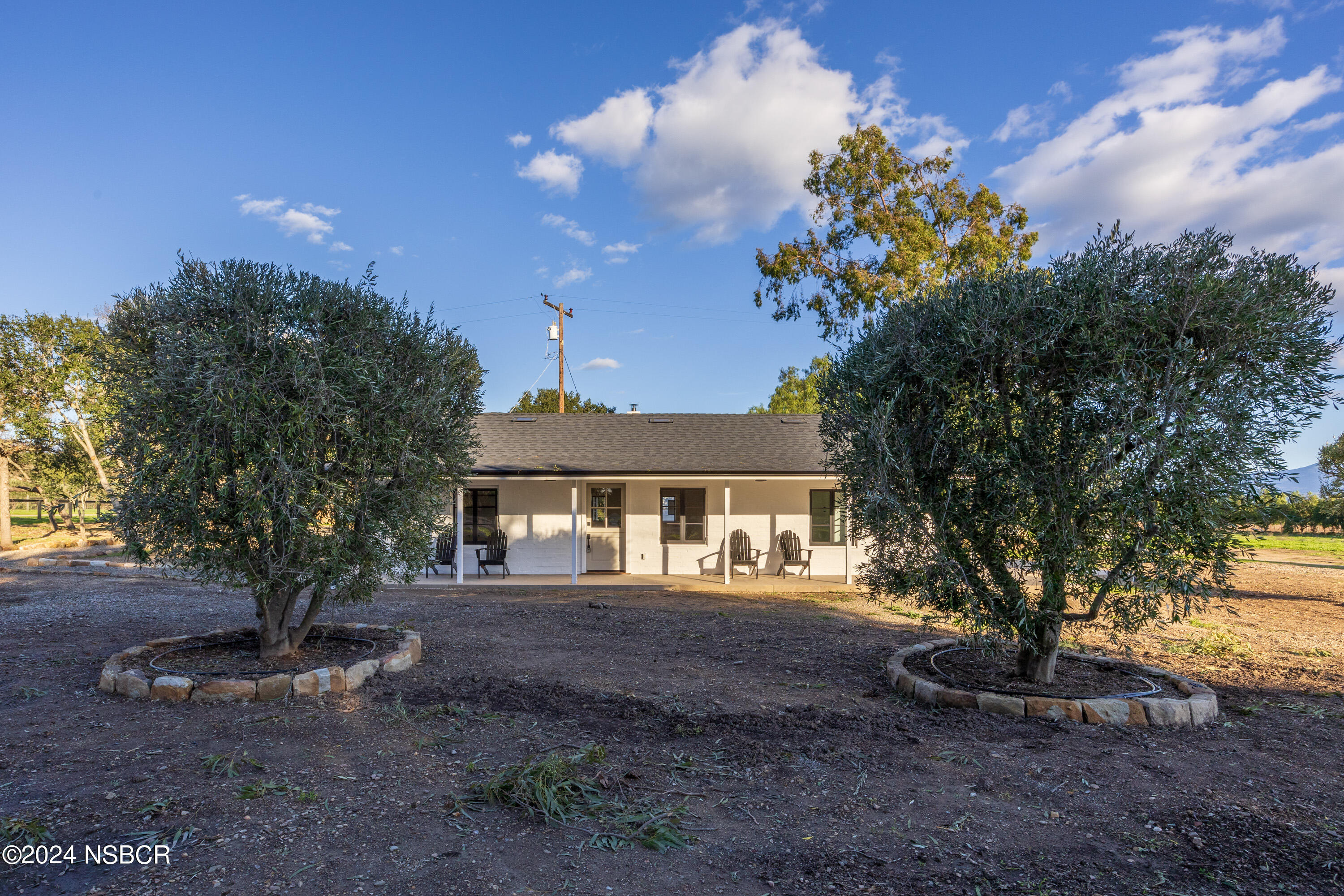 2380 North Refugio Road Santa Ynez, CA 93460 - Photo 3 of 38 a front view of a house with a yard