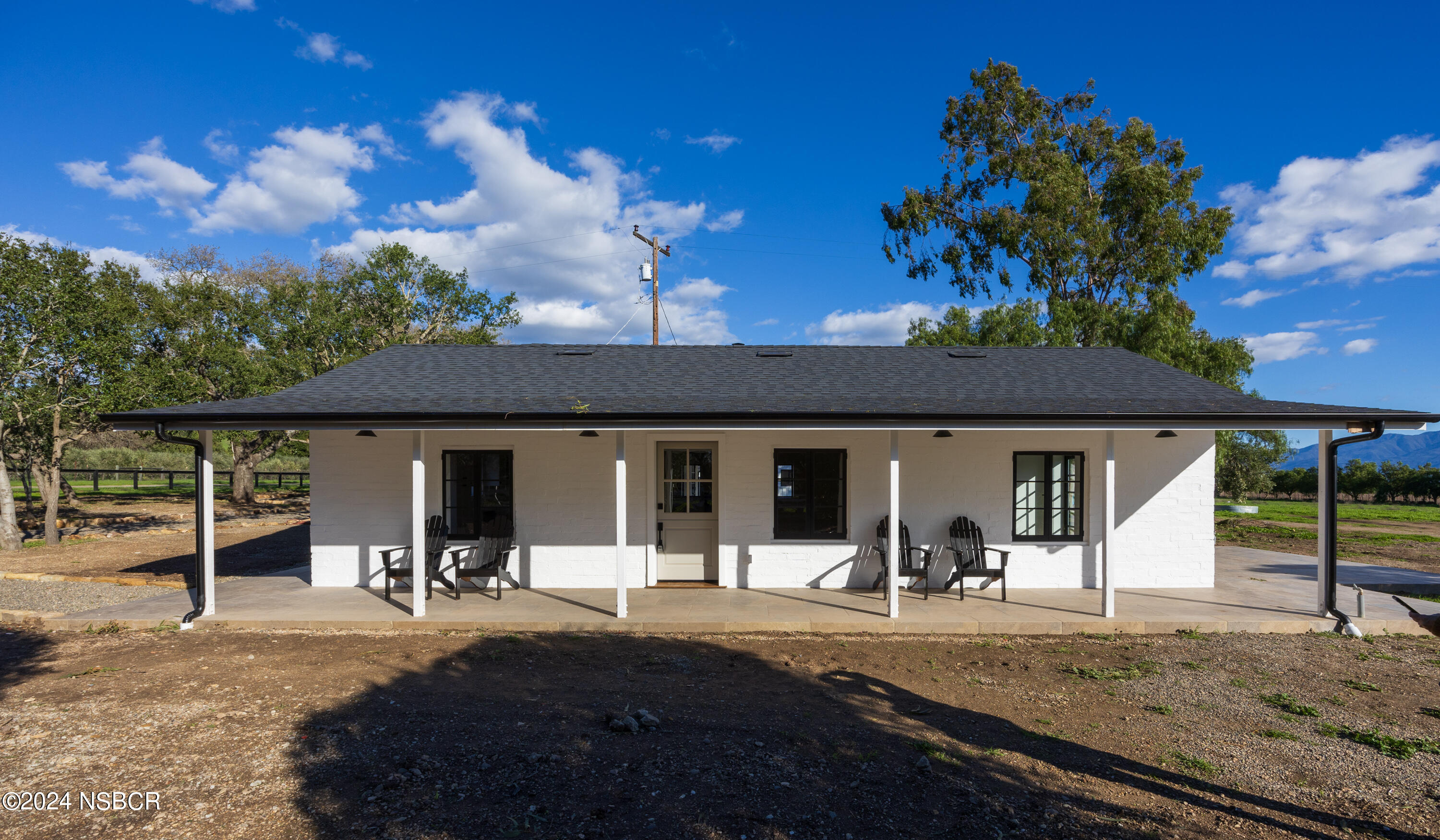2380 North Refugio Road Santa Ynez, CA 93460 - Photo 5 of 38 a view of a house with backyard porch and sitting area