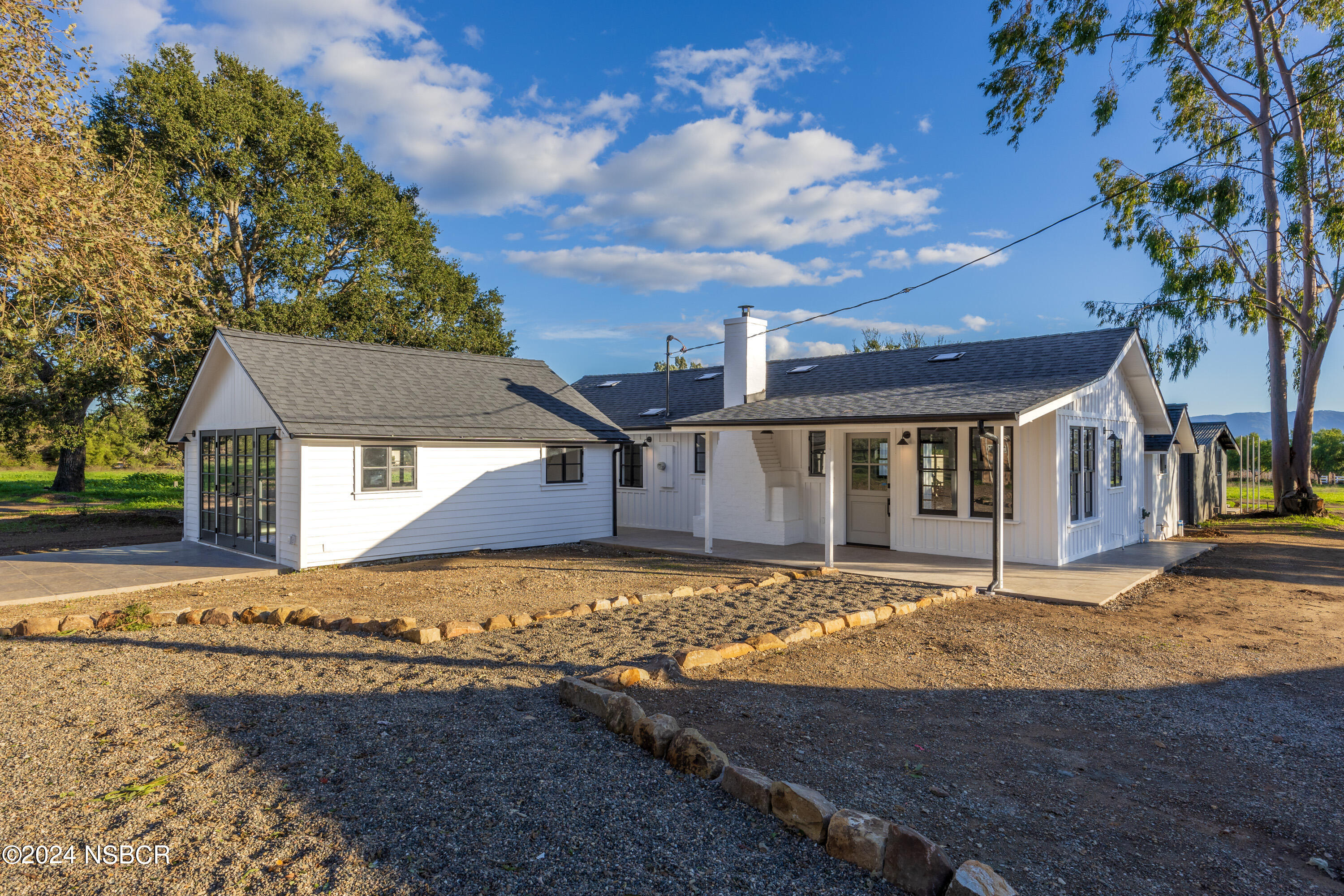 2380 North Refugio Road Santa Ynez, CA 93460 - Photo 6 of 38 a front view of a house with a yard