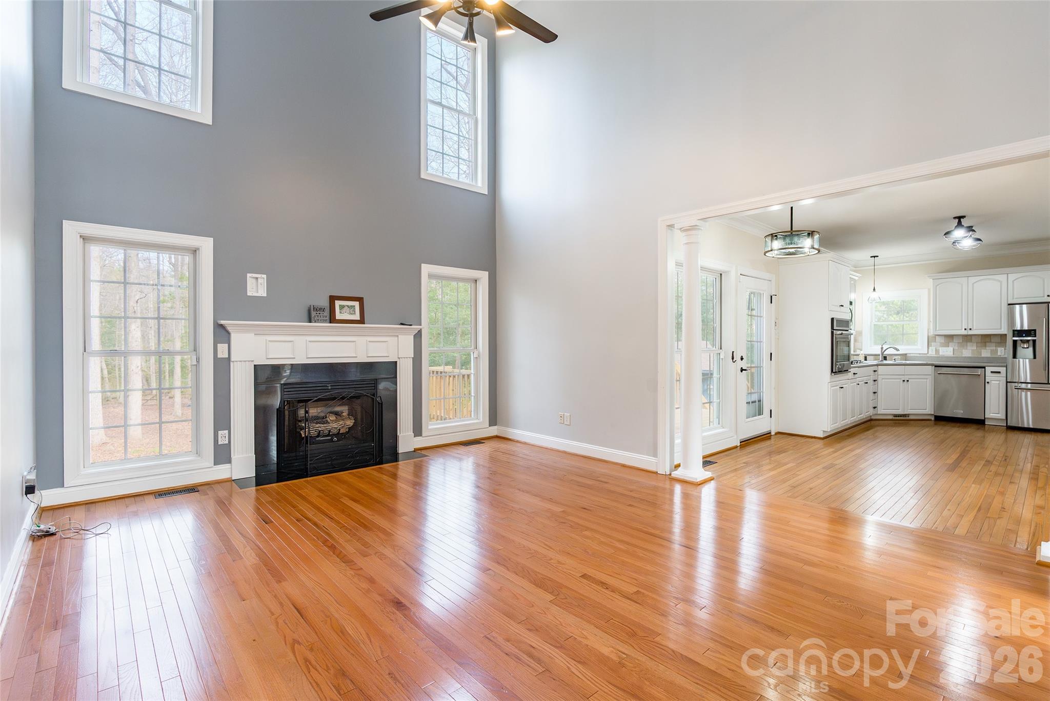 321 Forbes Court Clover, SC 29710 - Photo 6 of 31 a view of a livingroom with wooden floor and a fireplace