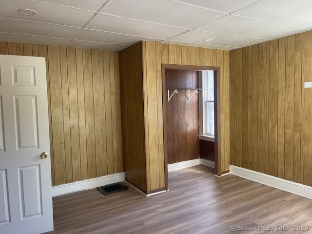 90 Waterville Street Waterbury, CT 06710 - Photo 18 of 20 an empty room with wooden floor and closet