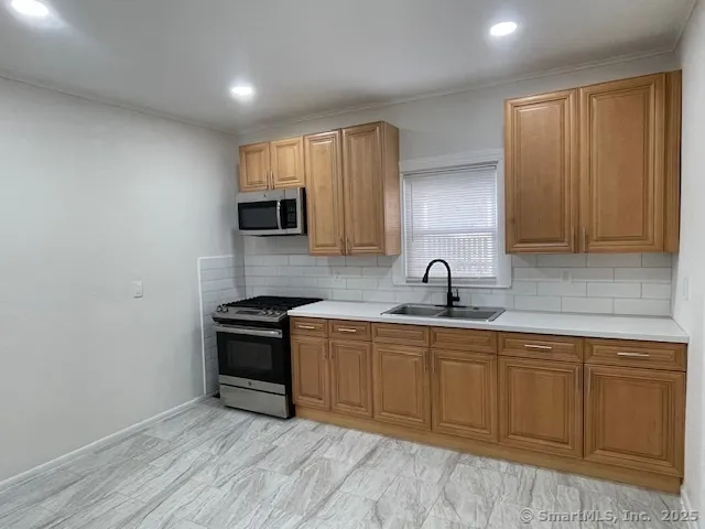 a kitchen with a sink and cabinets
